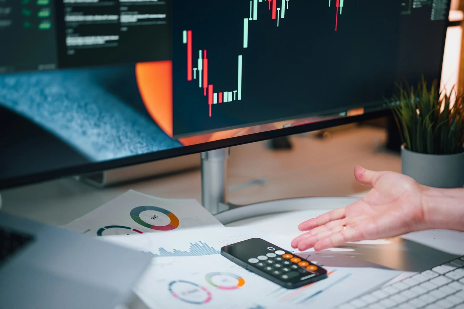 Financial analysis workspace with ledger documents, calculator, and financial reports