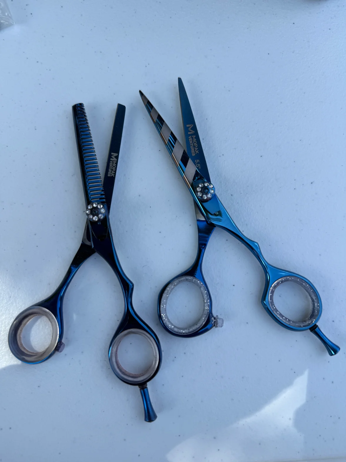 Blue finish hair shears with ergonomic finger rest