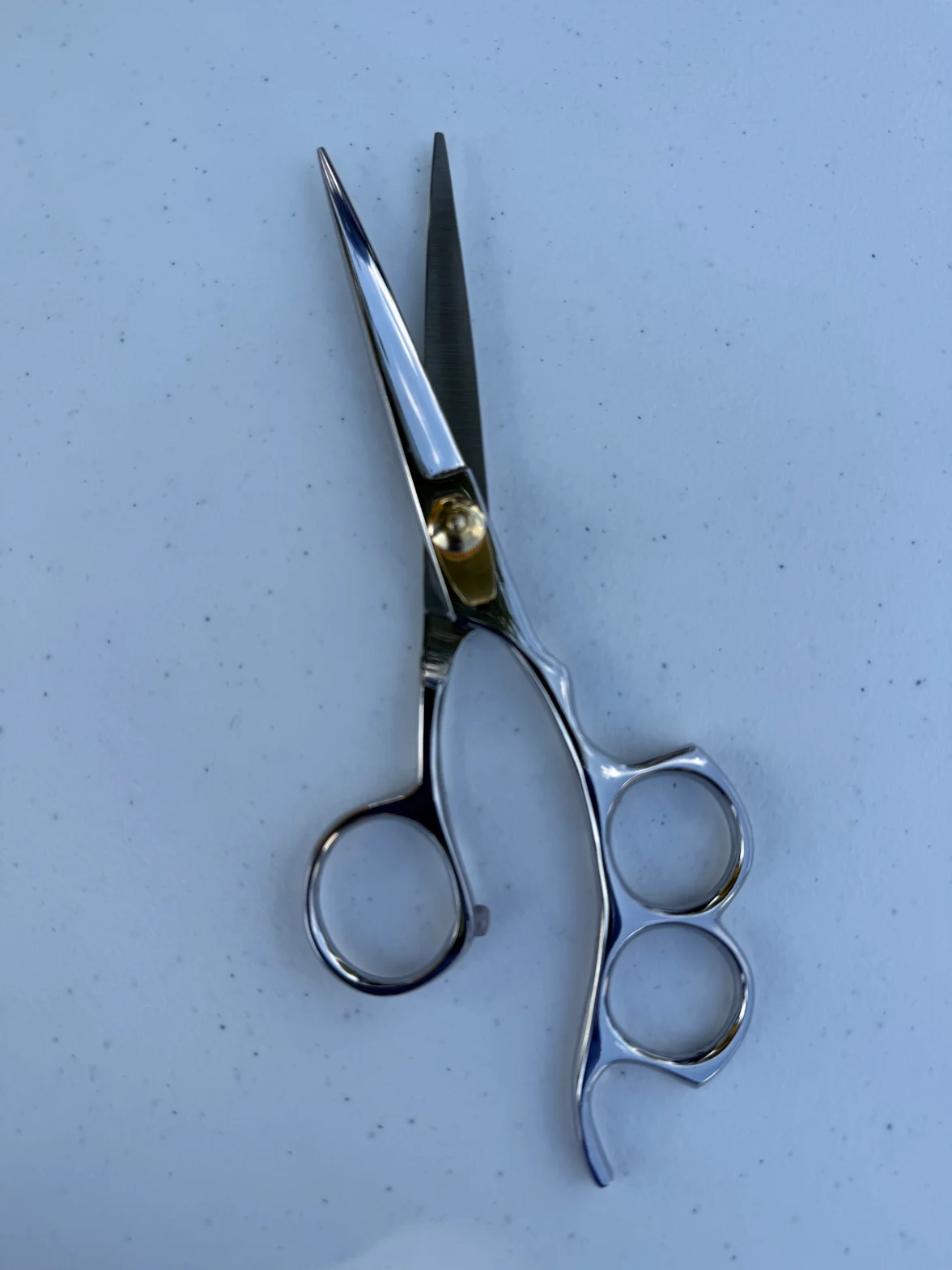 Professional hair-cutting scissors engineered for high hardness and corrosion resistance