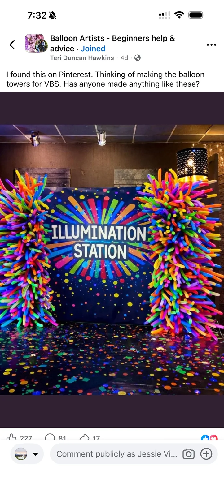 A balloon installation of rainbow coloured tubes arranged in starburst patterns on dark walls, scattered with confetti dots.